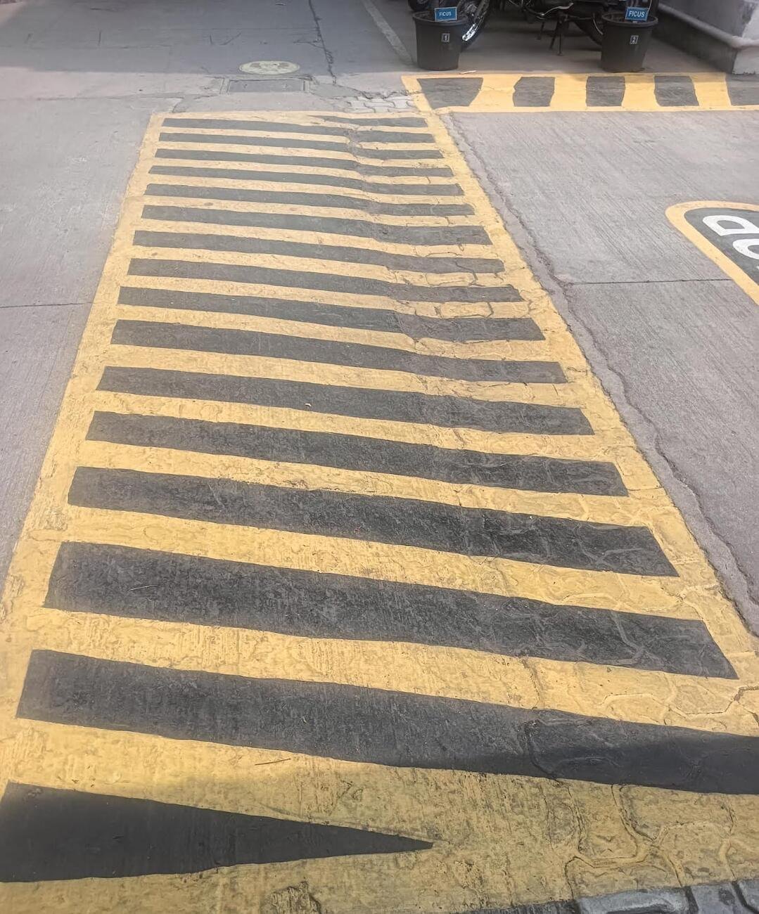 Freshly painted yellow and black hazard floor marking completed by the IFS crew