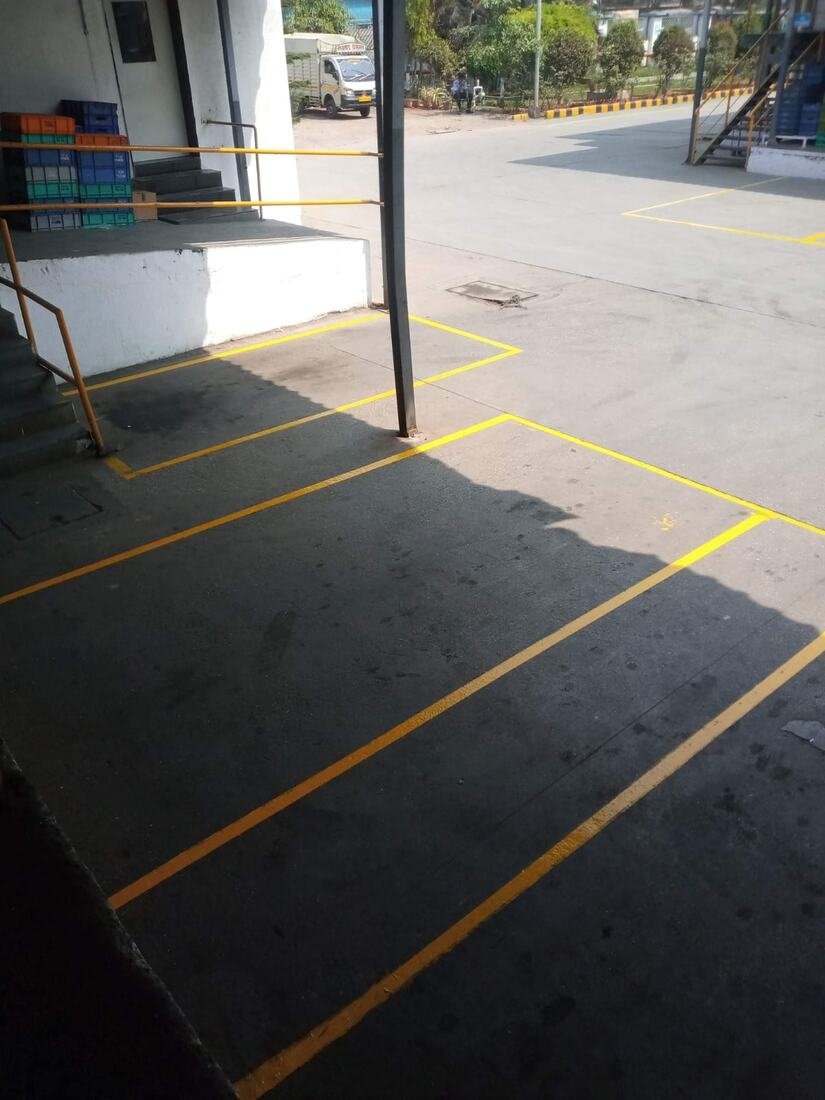 Yellow parking bay marking at a loading dock